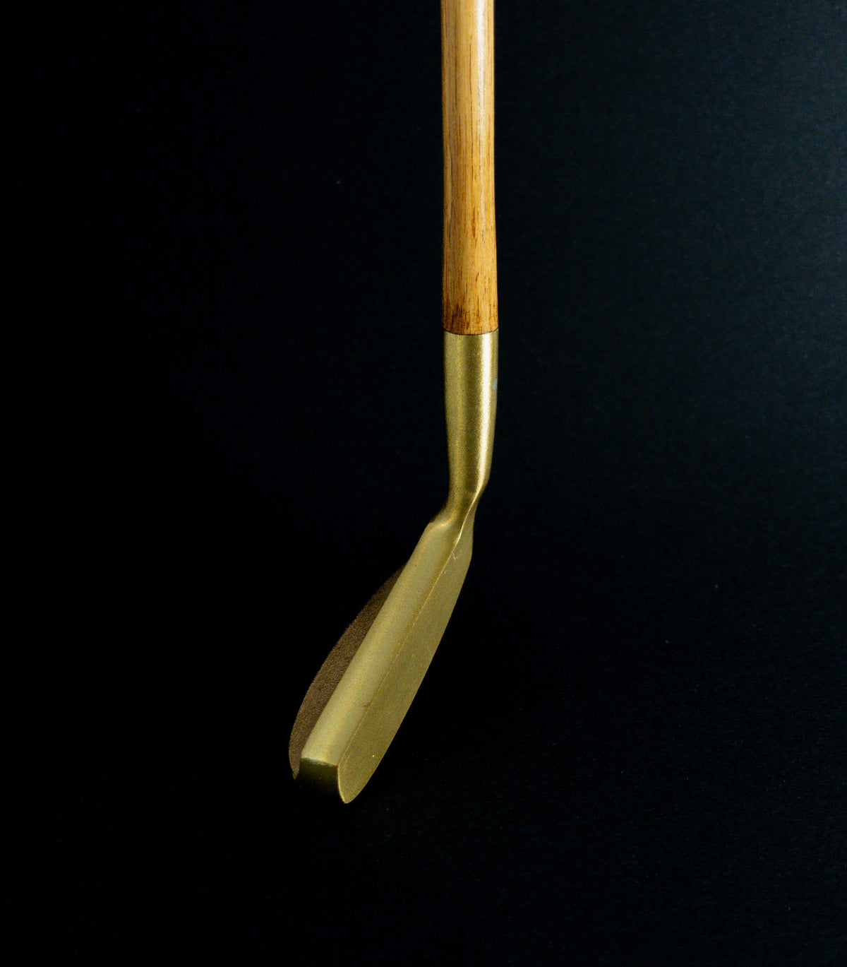 Otey 02H Knockout brass blade putter with hickory shaft, angled blade view